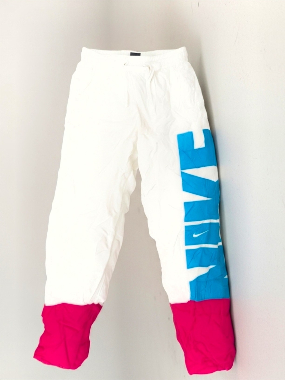 Nike Kids White Joggers with Blue Side Panel & Pink Cuffs